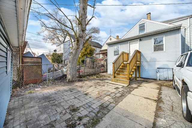1661 Euclid Ave, Chicago Heights, IL 60411 - back of property featuring a chimney and a patio area