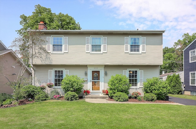 612 Aurora Way, Wheaton, IL 60187 - colonial home featuring a chimney and a front lawn