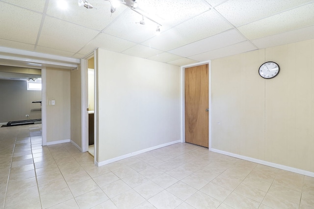 612 Aurora Way, Wheaton, IL 60187 - spare room with a drop ceiling, light tile patterned flooring, and baseboard heating