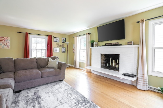 612 Aurora Way, Wheaton, IL 60187 - living area featuring wood finished floors, plenty of natural light, and a fireplace