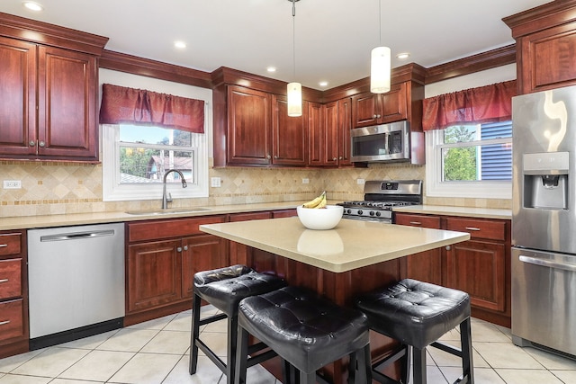 612 Aurora Way, Wheaton, IL 60187 - kitchen with stainless steel appliances, dark brown cabinets, light countertops, light tile patterned floors, and recessed lighting