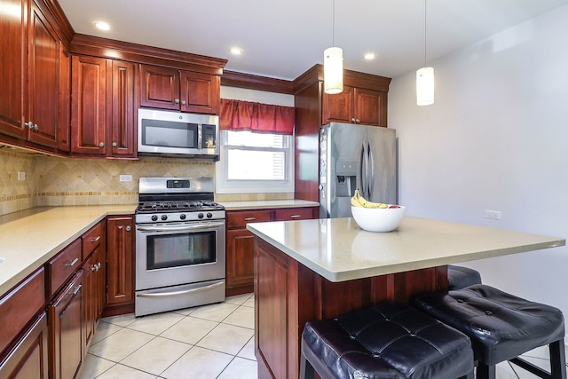 612 Aurora Way, Wheaton, IL 60187 - kitchen with stainless steel appliances, light countertops, decorative backsplash, a kitchen breakfast bar, and recessed lighting