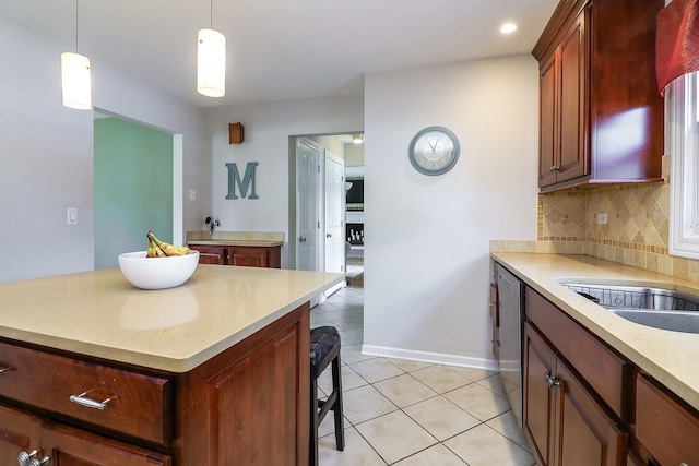 612 Aurora Way, Wheaton, IL 60187 - kitchen with light countertops, decorative backsplash, decorative light fixtures, dishwasher, and light tile patterned flooring