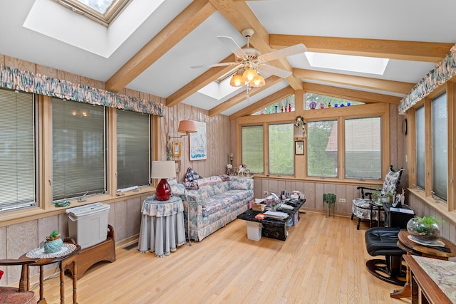 16 W Monroe St, Villa Park, IL 60181 - living room featuring a skylight, ceiling fan, wood finished floors, and wooden walls