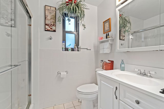 16 W Monroe St, Villa Park, IL 60181 - bathroom with tile walls, a stall shower, toilet, vanity, and tile patterned flooring