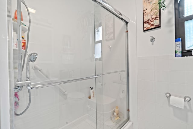 16 W Monroe St, Villa Park, IL 60181 - bathroom featuring a stall shower, tile walls, and toilet