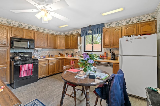 16 W Monroe St, Villa Park, IL 60181 - kitchen featuring black appliances, light countertops, and brown cabinetry