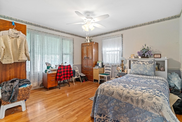 16 W Monroe St, Villa Park, IL 60181 - bedroom with wallpapered walls, wood finished floors, and a ceiling fan
