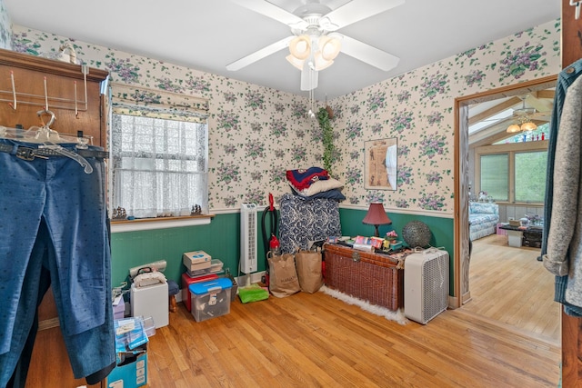 16 W Monroe St, Villa Park, IL 60181 - bedroom with wallpapered walls, a wainscoted wall, wood finished floors, and a ceiling fan