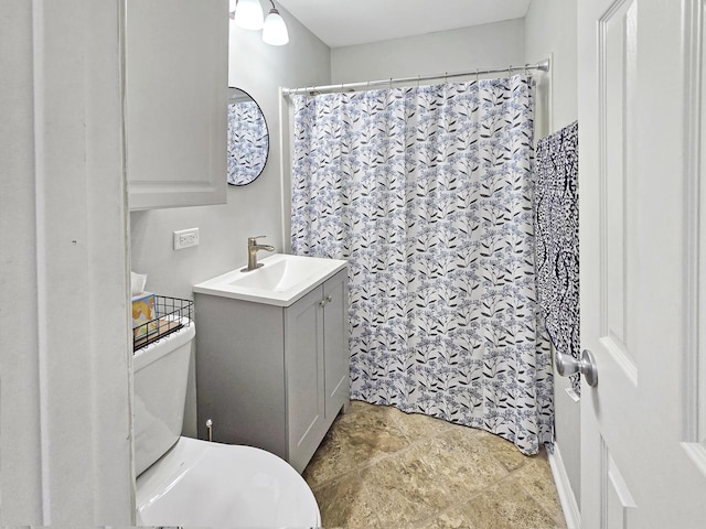 110 Louis Rd, Joliet, IL 60433 - bathroom featuring vanity, stone finish flooring, toilet, and curtained shower