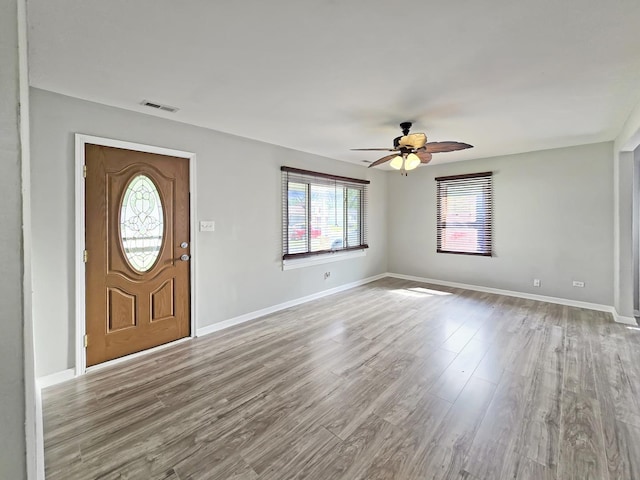 110 Louis Rd, Joliet, IL 60433 - entryway featuring ceiling fan, wood finished floors, and baseboards
