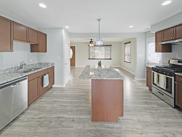 110 Louis Rd, Joliet, IL 60433 - kitchen featuring stainless steel appliances, under cabinet range hood, a sink, baseboards, and recessed lighting