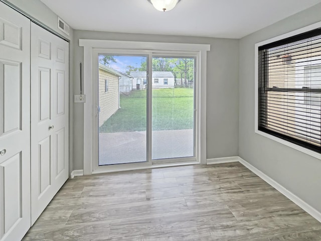 110 Louis Rd, Joliet, IL 60433 - unfurnished dining area with baseboards and wood finished floors