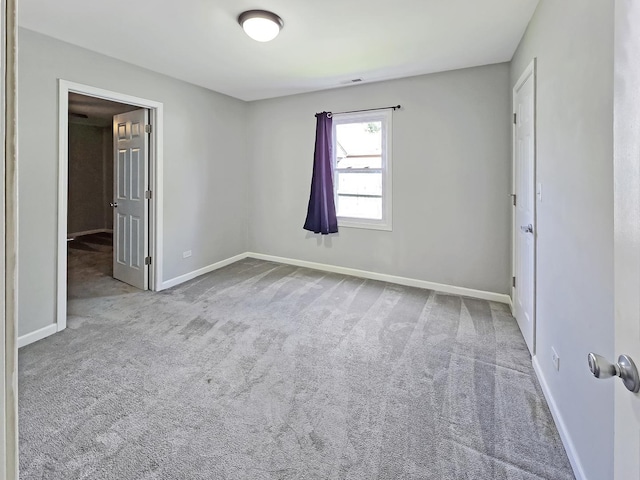 110 Louis Rd, Joliet, IL 60433 - unfurnished bedroom with carpet flooring and baseboards
