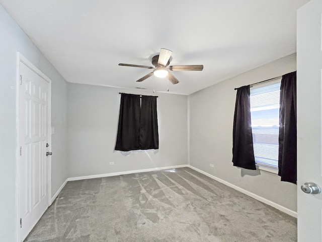 110 Louis Rd, Joliet, IL 60433 - unfurnished bedroom featuring carpet floors, baseboards, and ceiling fan