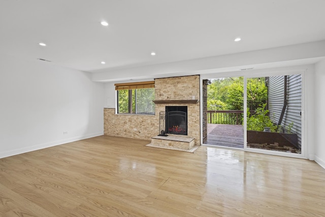 3S261 Briarwood Dr, Warrenville, IL 60555 - unfurnished living room featuring a fireplace, light wood-type flooring, recessed lighting, and baseboards