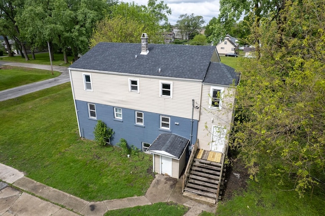 17231 Laflin Ave, East Hazel Crest, IL 60429 - back of property with a chimney, a yard, and roof with shingles