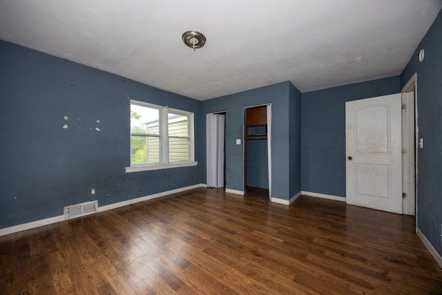 17231 Laflin Ave, East Hazel Crest, IL 60429 - unfurnished bedroom featuring wood finished floors, two closets, and baseboards