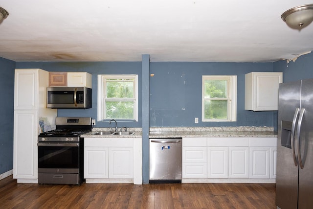 17231 Laflin Ave, East Hazel Crest, IL 60429 - kitchen with appliances with stainless steel finishes, a sink, white cabinetry, and dark wood-style floors