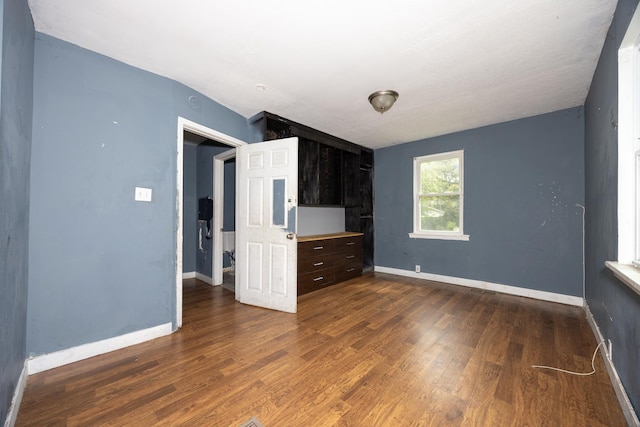 17231 Laflin Ave, East Hazel Crest, IL 60429 - unfurnished bedroom with dark wood-style floors and baseboards