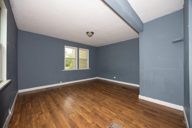 17231 Laflin Ave, East Hazel Crest, IL 60429 - empty room featuring wood finished floors, beam ceiling, and baseboards