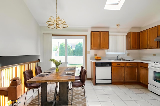 18133 Brittany Ln, Lansing, IL 60438 - kitchen with white appliances, brown cabinetry, a chandelier, light countertops, and a skylight