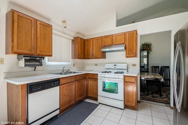 18133 Brittany Ln, Lansing, IL 60438 - kitchen featuring white appliances, under cabinet range hood, lofted ceiling, brown cabinetry, and light countertops