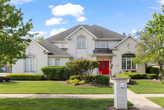 10423 Capistrano Ln, Orland Park, IL 60467 - view of front facade with a front lawn, roof with shingles, and brick siding