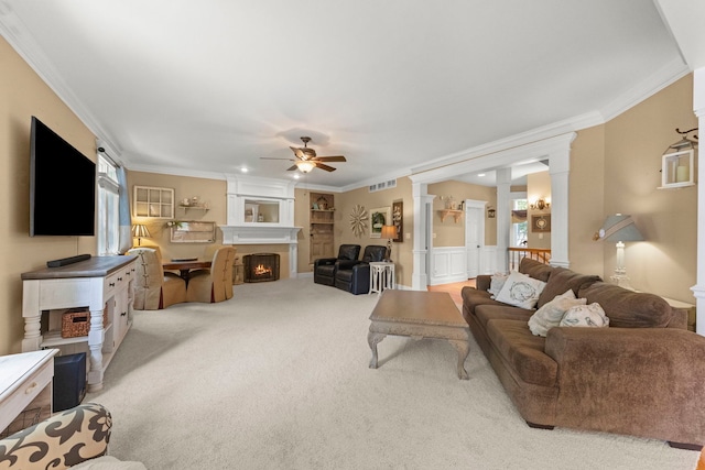 10423 Capistrano Ln, Orland Park, IL 60467 - living room with a ceiling fan, decorative columns, ornamental molding, carpet, and a warm lit fireplace