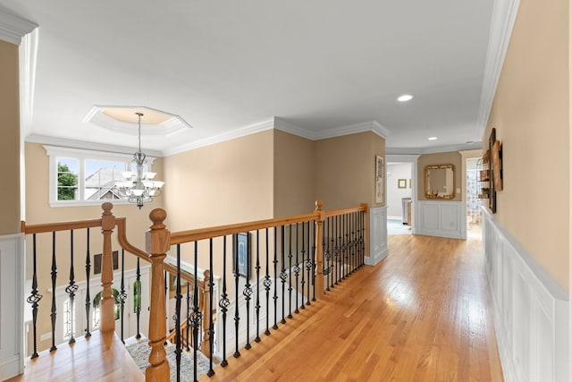 10423 Capistrano Ln, Orland Park, IL 60467 - corridor with a decorative wall, light wood-style flooring, a chandelier, an upstairs landing, and ornamental molding