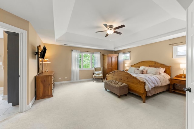 10423 Capistrano Ln, Orland Park, IL 60467 - bedroom with a tray ceiling, light colored carpet, and a ceiling fan