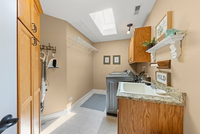 10423 Capistrano Ln, Orland Park, IL 60467 - washroom with a skylight, cabinet space, washer / dryer, and light tile patterned floors