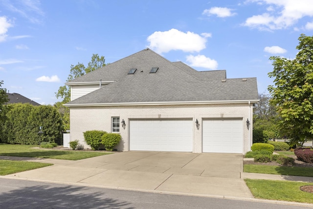 10423 Capistrano Ln, Orland Park, IL 60467 - view of property exterior featuring a garage, driveway, roof with shingles, and brick siding