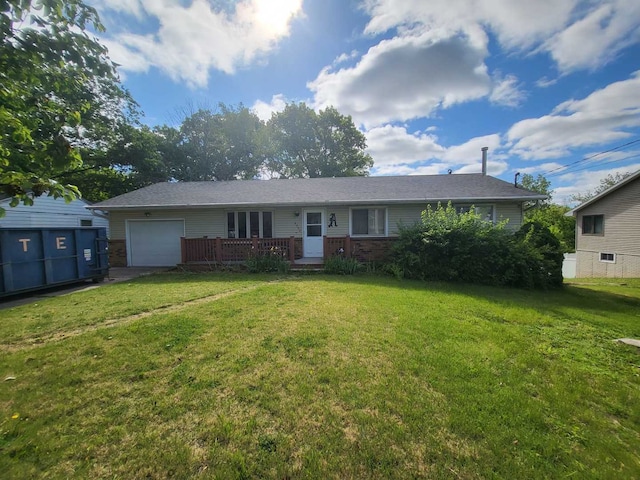 4502 NW Scenic Dr, Peoria, IL 61615 - single story home featuring an attached garage, a front lawn, a wooden deck, and brick siding