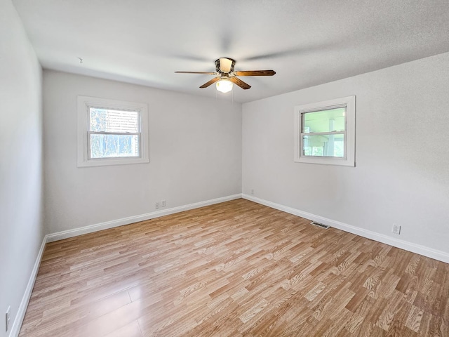 511 E Stimmel St, West Chicago, IL 60185 - unfurnished room featuring light wood finished floors, ceiling fan, and baseboards