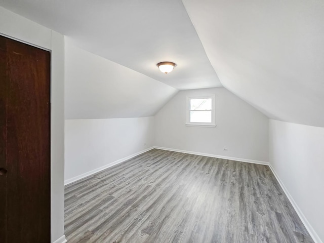 511 E Stimmel St, West Chicago, IL 60185 - bonus room with wood finished floors, baseboards, and lofted ceiling