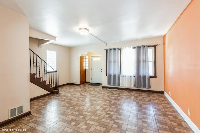 10624 S Ave H Rd, Chicago, IL 60617 - foyer entrance with baseboards, plenty of natural light, and stairs
