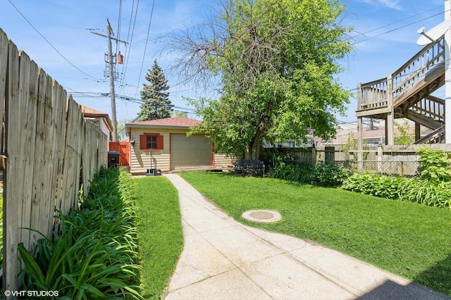 10624 S Ave H Rd, Chicago, IL 60617 - view of yard featuring driveway, an outdoor structure, and stairs