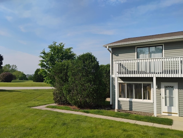 17429 W Chestnut Ln, Gurnee, IL 60031 - view of side of property featuring a yard and a balcony