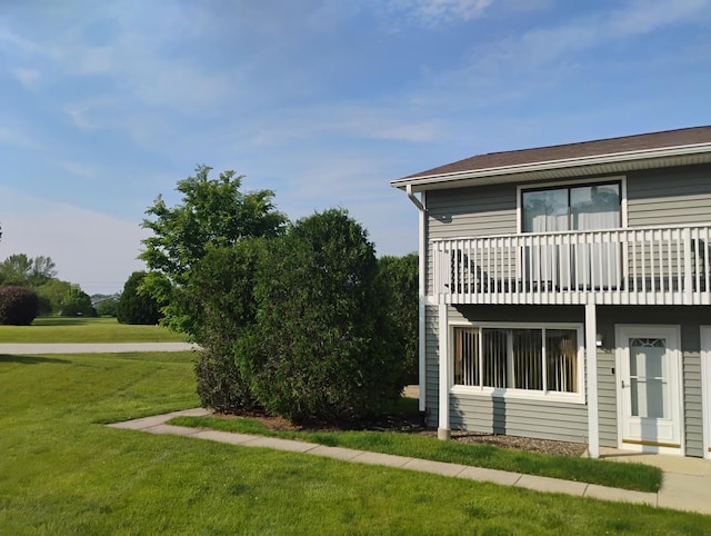 17429 W Chestnut Ln, Gurnee, IL 60031 - view of home's exterior featuring a lawn and a balcony