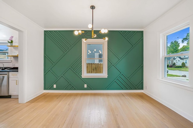 9602 S Troy Ave, Evergreen Park, IL 60805 - unfurnished dining area with a chandelier, baseboards, light wood finished floors, ornamental molding, and a decorative wall