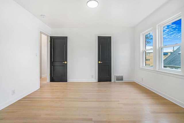 9602 S Troy Ave, Evergreen Park, IL 60805 - unfurnished bedroom with light wood-style floors and baseboards