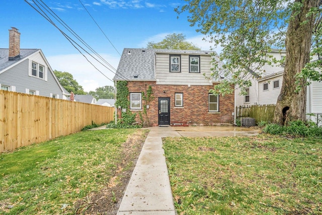 9602 S Troy Ave, Evergreen Park, IL 60805 - view of front of property with brick siding, a patio, and central AC