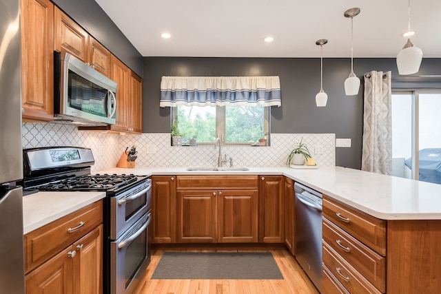 210 Des Plaines Ave Unit B, Forest Park, IL 60130 - kitchen featuring stainless steel appliances, a peninsula, a sink, healthy amount of natural light, and recessed lighting
