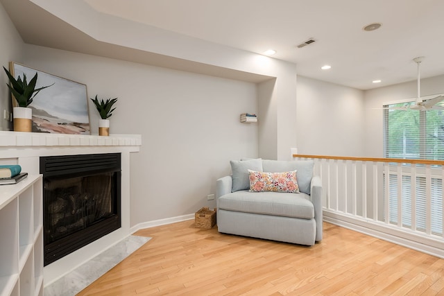 210 Des Plaines Ave Unit B, Forest Park, IL 60130 - living area featuring light wood-type flooring, a fireplace with flush hearth, recessed lighting, and baseboards