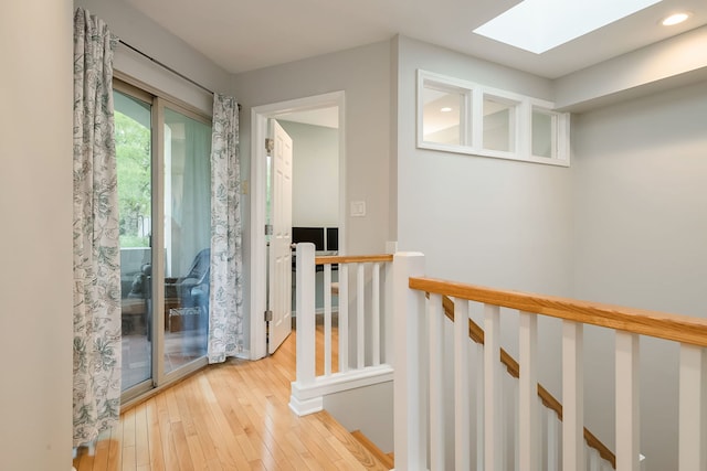 210 Des Plaines Ave Unit B, Forest Park, IL 60130 - hallway with an upstairs landing, a skylight, hardwood / wood-style flooring, and recessed lighting