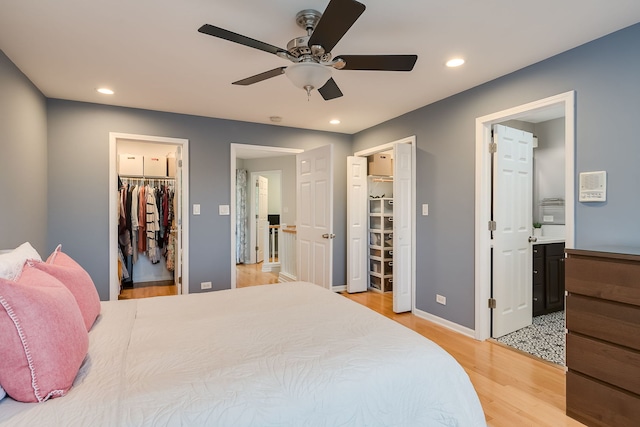 210 Des Plaines Ave Unit B, Forest Park, IL 60130 - bedroom featuring a spacious closet, light wood finished floors, a closet, recessed lighting, and ensuite bathroom