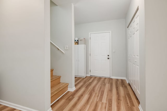 210 Des Plaines Ave Unit B, Forest Park, IL 60130 - foyer entrance with light wood-type flooring, baseboards, and stairway