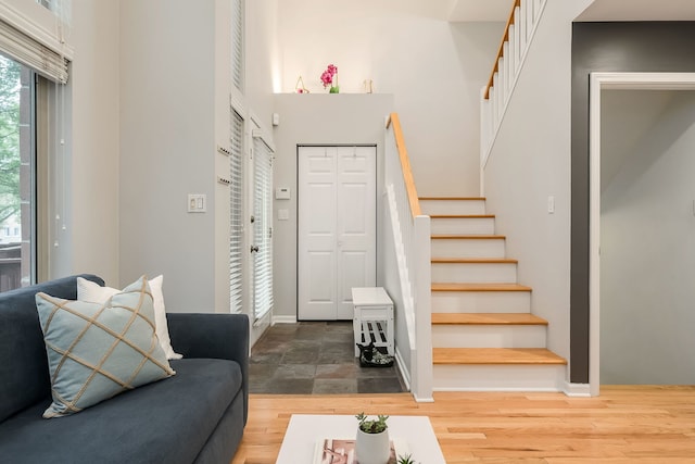 210 Des Plaines Ave Unit B, Forest Park, IL 60130 - foyer with stairway, baseboards, dark wood finished floors, and a high ceiling