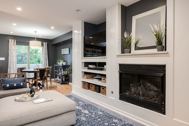 210 Des Plaines Ave Unit B, Forest Park, IL 60130 - living area featuring wood finished floors, recessed lighting, baseboards, and a fireplace